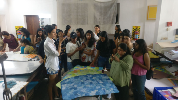 Girls watching handmade paper